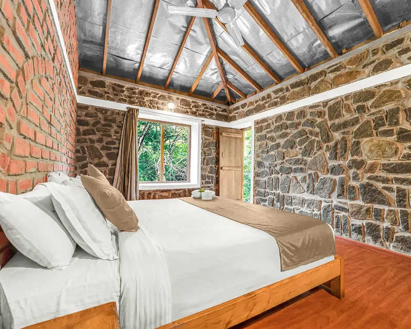 The Stream View Suite, stone walls and a window onto the trees