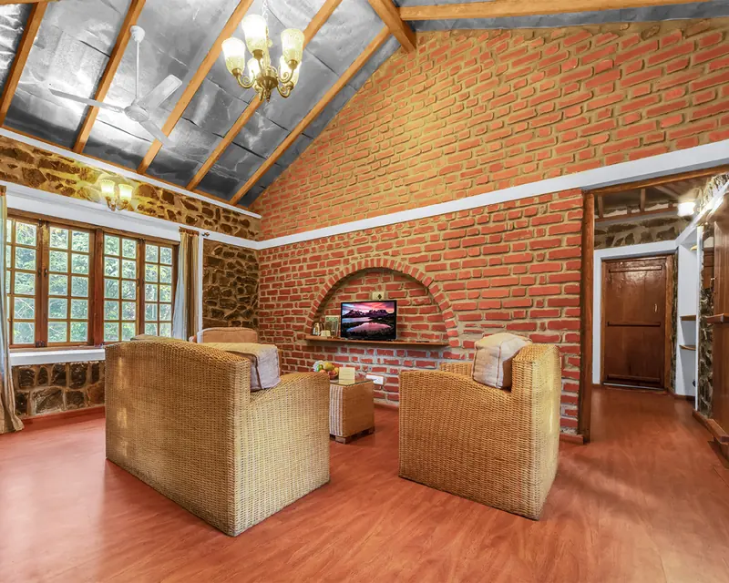 The sitting area of the Valley View Suite, windows onto the greenery